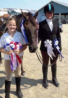 Winning ribbons at horse show